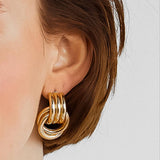 Timeless oval hoop earrings with a sleek two-tone design, crafted from 18K gold-plated stainless steel. Measuring 0.86 x 1.24 inches, these polished, tarnish-resistant earrings are hypoallergenic, water-resistant, and perfect for both casual and formal wear.