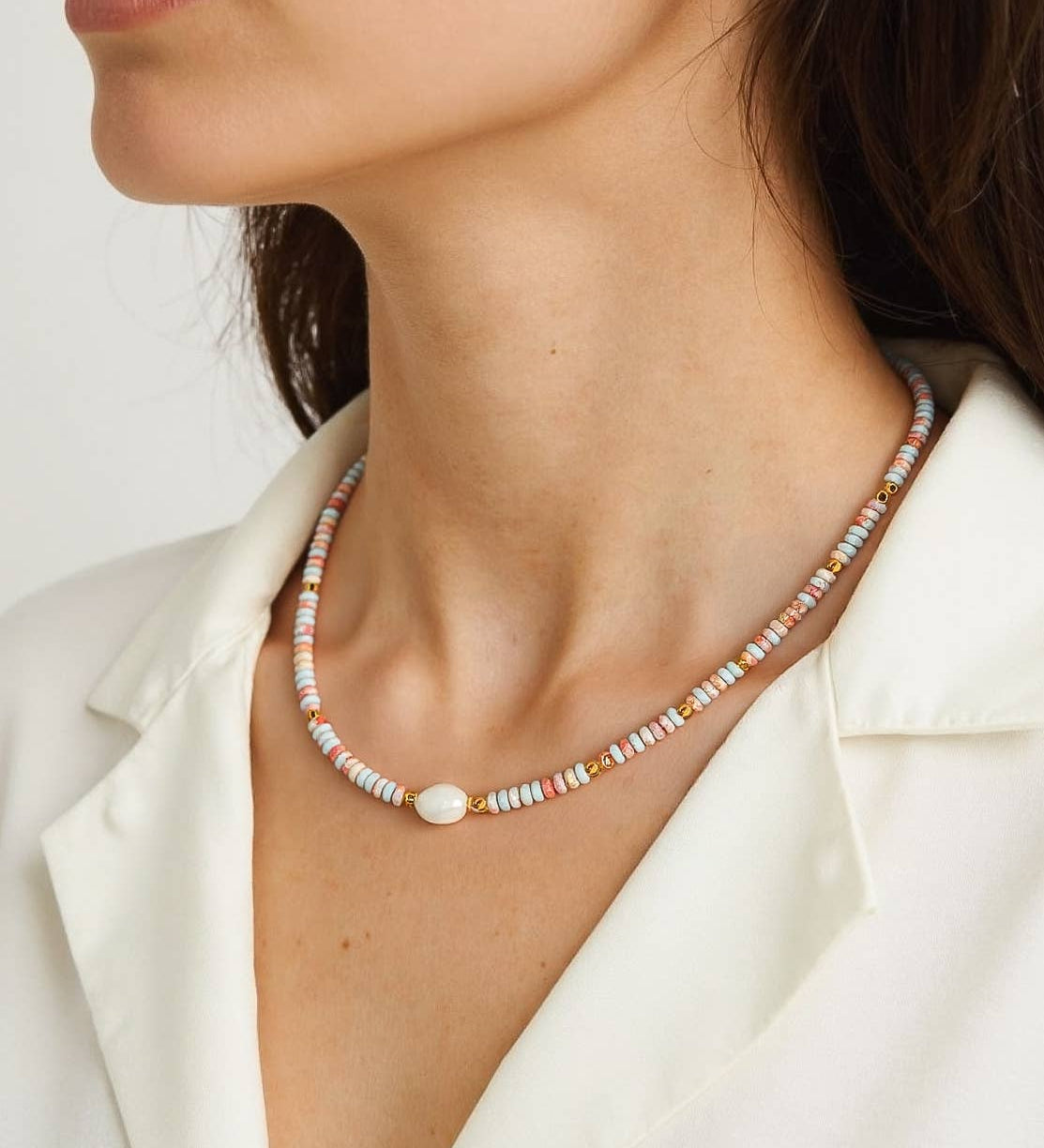 Chic necklace crafted from stainless steel, featuring minimalist beaded detailing and natural freshwater pearls. Length 16 inches plus 2-inch extender for adjustable fit. Hypoallergenic, water- and tarnish-resistant—perfect for adding a playful yet elegant touch to any look.