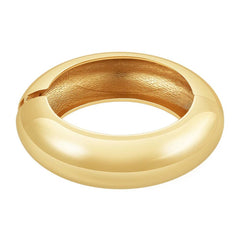Striking statement bangle with a wide 23mm polished silhouette, crafted from 18K gold-plated stainless steel. Features a hinged opening for easy wear. Hypoallergenic, water- and tarnish-resistant—designed to turn heads and elevate any outfit with bold elegance.