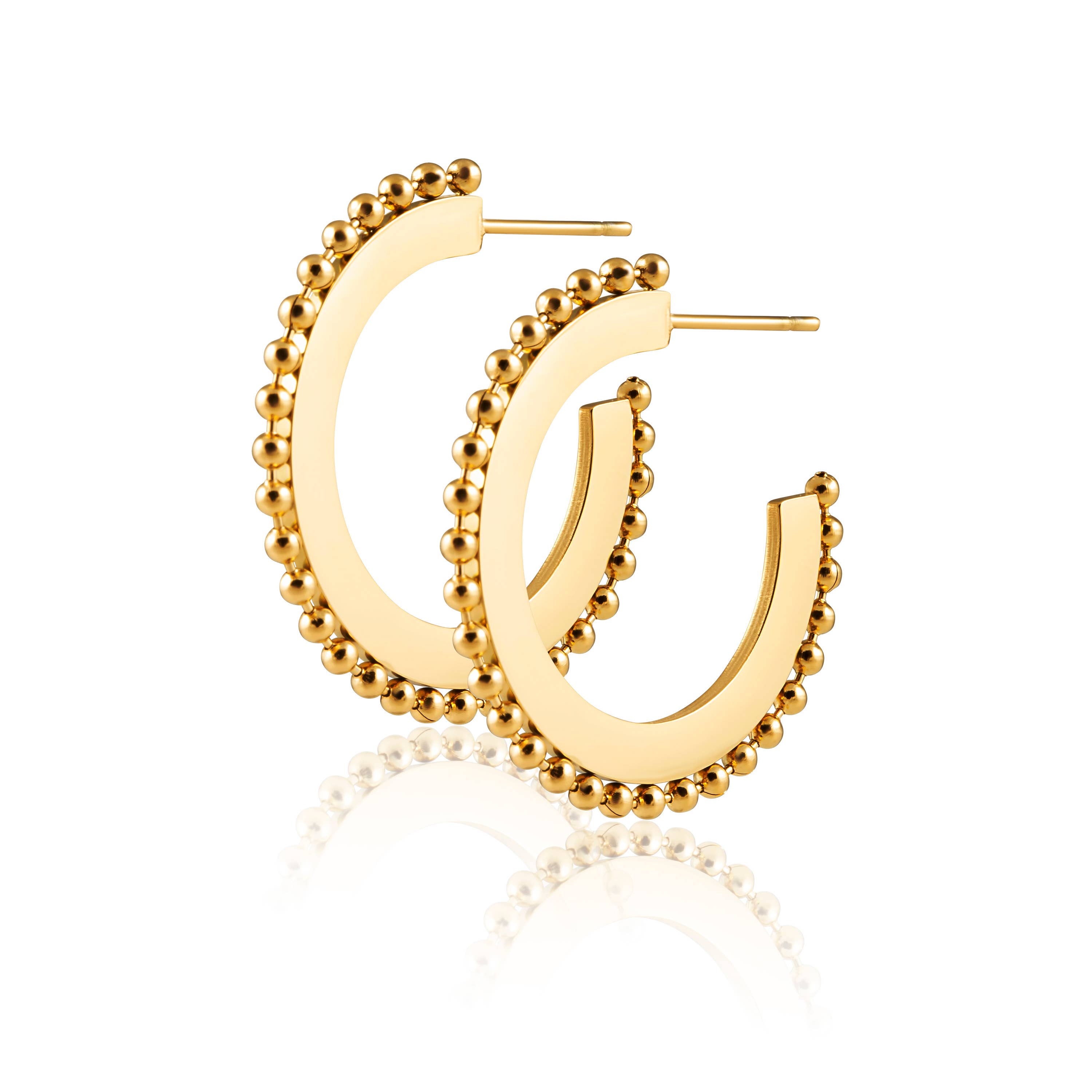 Bold yet minimal hoop earrings featuring a sleek flat profile and subtle studded texture for a contemporary edge. Crafted from 18K gold-plated stainless steel, these hypoallergenic, water- and tarnish-resistant hoops are perfect for elevating everyday looks with effortless sophistication.