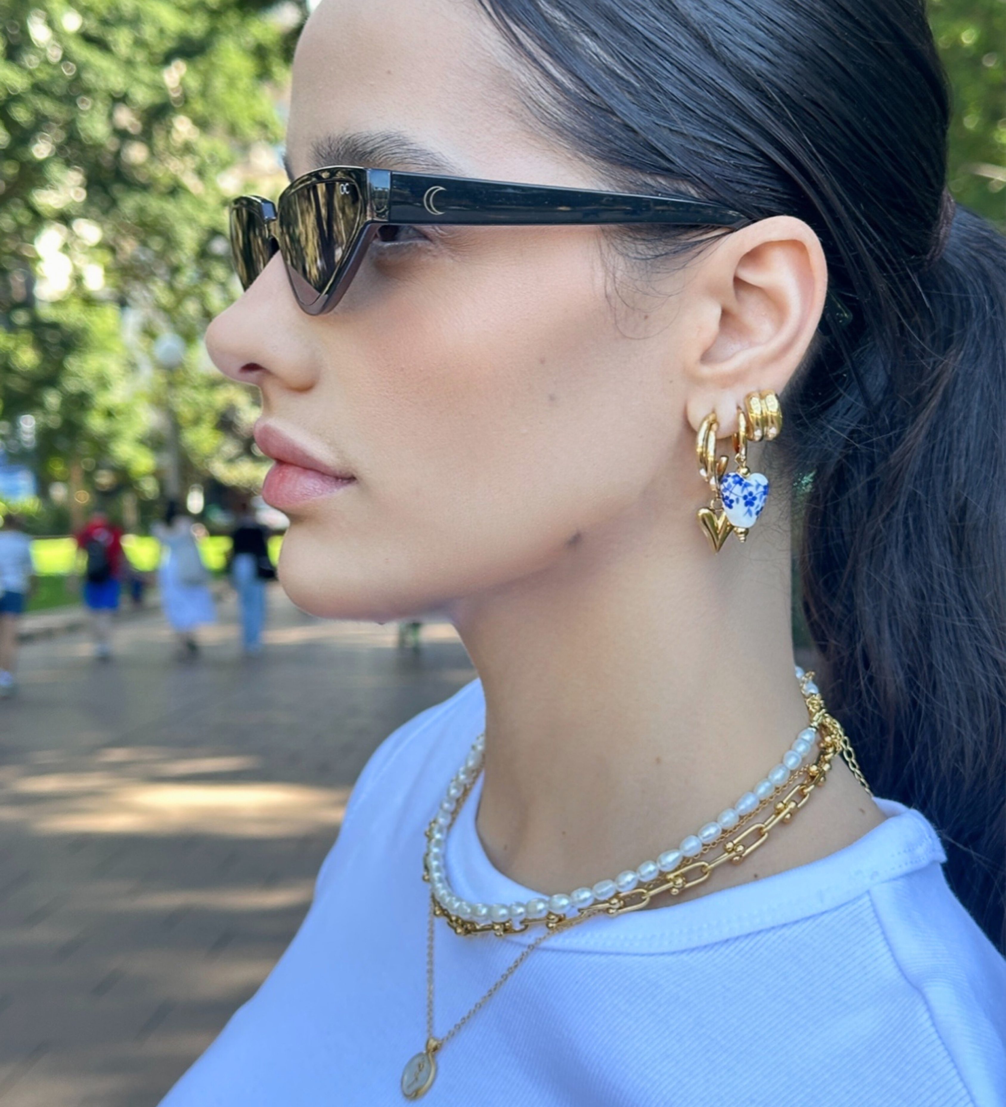 Romantic heart-shaped drop earrings crafted from 18K gold-plated stainless steel with artisanal ceramic floral clay detailing. Lightweight and hypoallergenic, water- and tarnish-resistant—perfect for adding a whimsical, handcrafted touch to any jewellery collection.