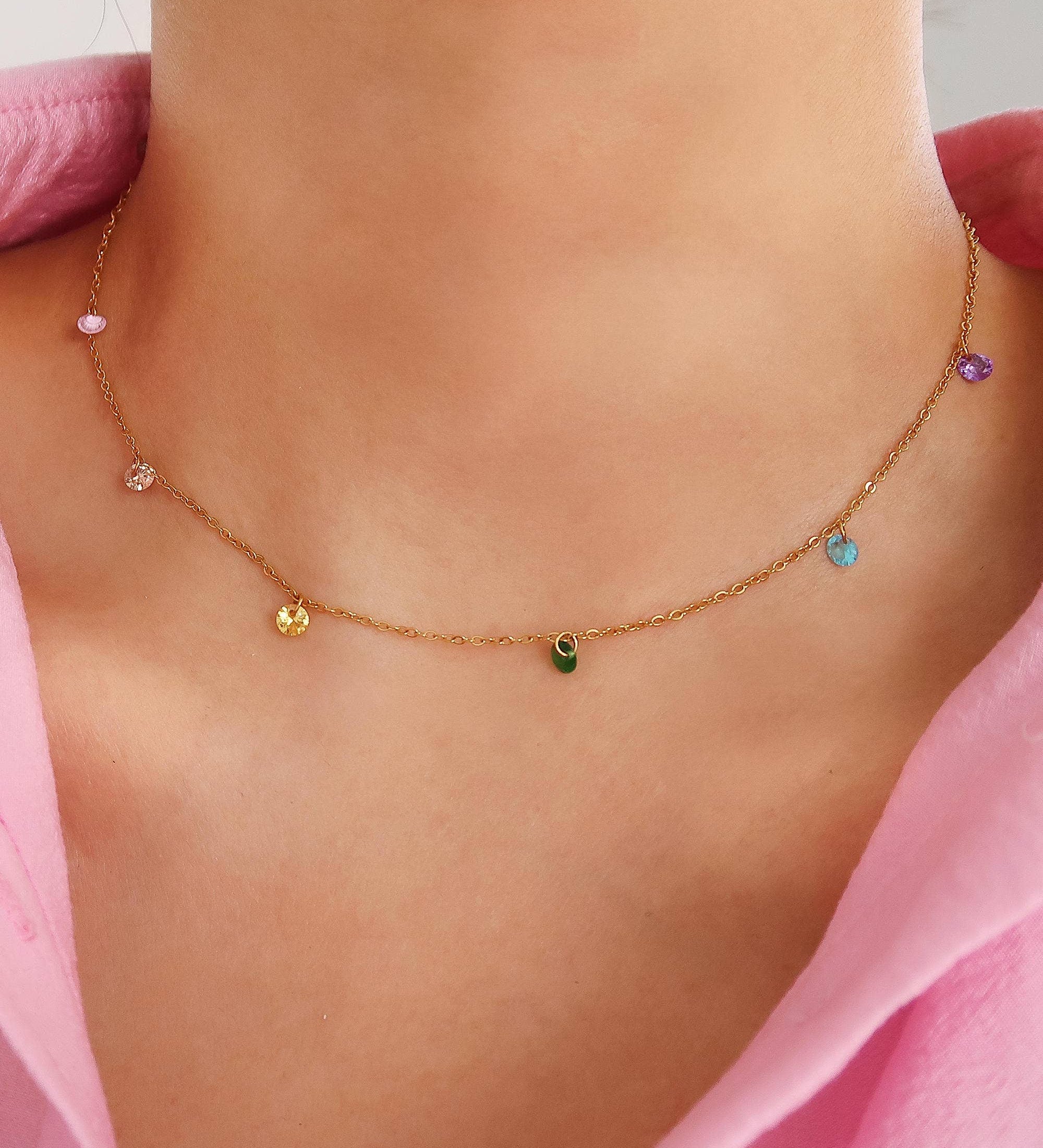 Delicate necklace crafted from 18K gold-plated stainless steel, featuring petite cubic zirconia accents for subtle brilliance. Chain length 15 inches. Hypoallergenic, nickel-free, tarnish- and water-resistant—perfect for adding refined sparkle to any everyday look.