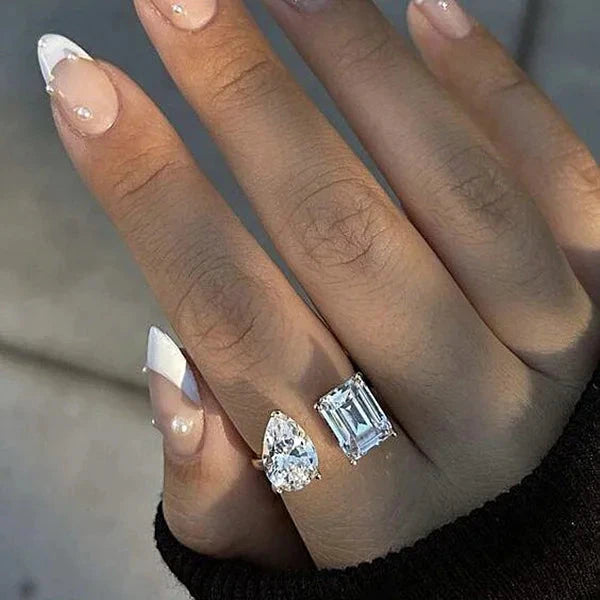 Elegant band ring crafted from certified 925 sterling silver, featuring a round-cut sapphire centre stone accented by natural side stones. Hypoallergenic, water- and tarnish-resistant—perfect for celebrating love, commitment, and timeless beauty.