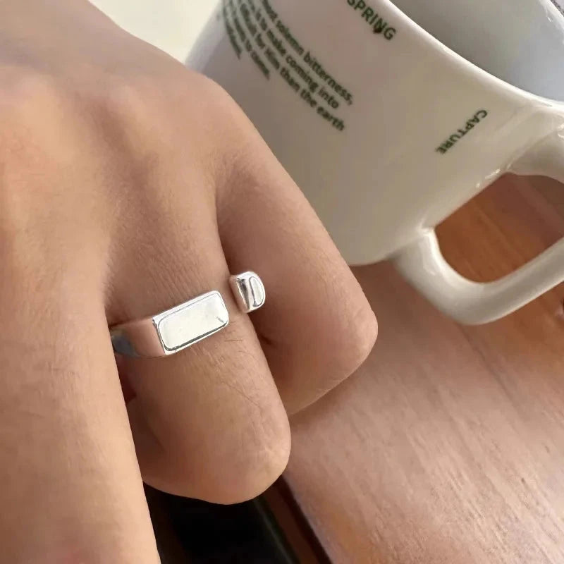 Modern hollow ring crafted from solid 925 sterling silver, featuring overlapping bands and a minimalist silhouette. Hypoallergenic, water- and tarnish-resistant—perfect for adding timeless sophistication and contemporary style to any jewellery collection.