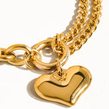 Delicate chain bracelet featuring polished heart-shaped links measuring 0.7 x 0.7 inches, crafted from 18K gold-plated stainless steel. Chain length 6 inches with a 1-inch extender. Non-tarnish, hypoallergenic, lead- and nickel-free, and water-resistant—perfect for adding romantic elegance to any look.