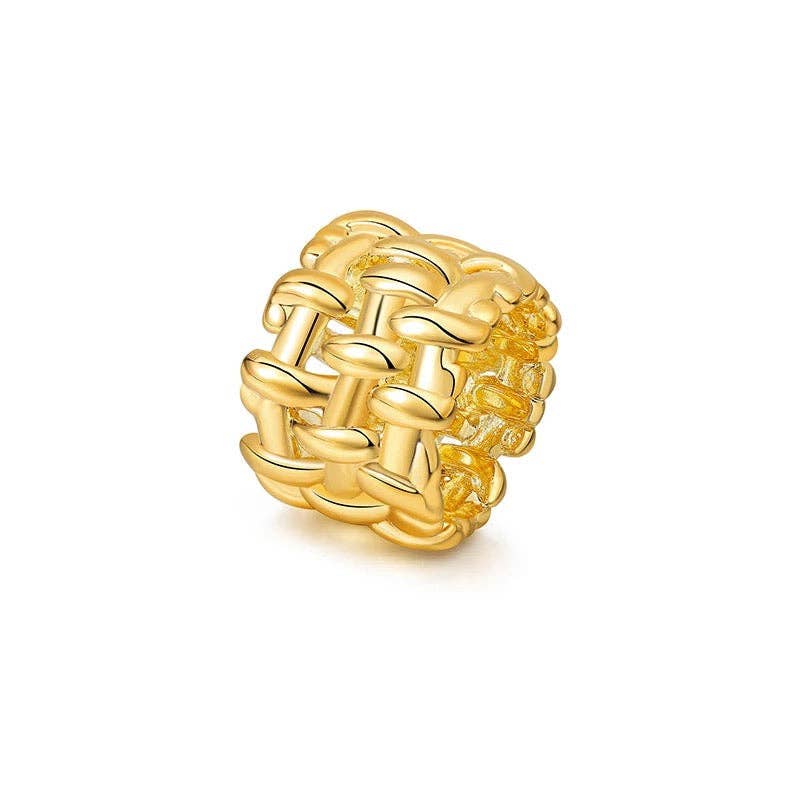 Gold woven ring on a white background