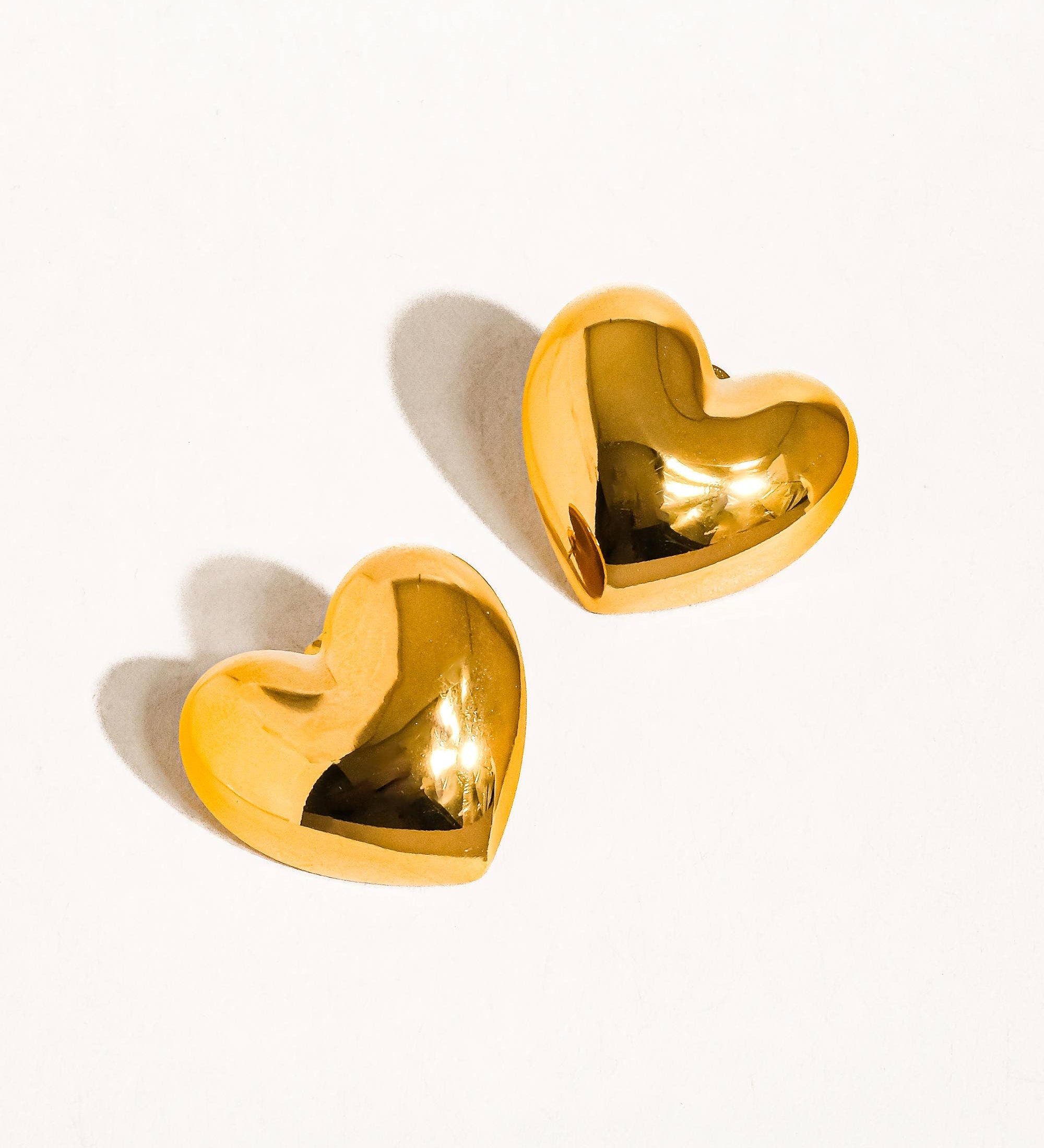 Gold   heart-shaped stud earrings 