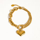 Delicate chain bracelet featuring polished heart-shaped links measuring 0.7 x 0.7 inches, crafted from 18K gold-plated stainless steel. Chain length 6 inches with a 1-inch extender. Non-tarnish, hypoallergenic, lead- and nickel-free, and water-resistant—perfect for adding romantic elegance to any look.