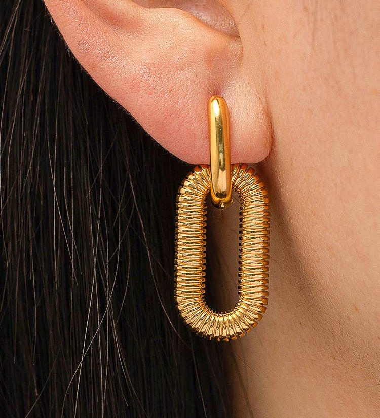 Modern hoop earrings crafted from stainless steel with your choice of 18K gold or silver plating, featuring a double chain detail for added edge and sophistication. Hypoallergenic, water- and tarnish-resistant—perfect for making a bold yet refined statement in any jewellery rotation.