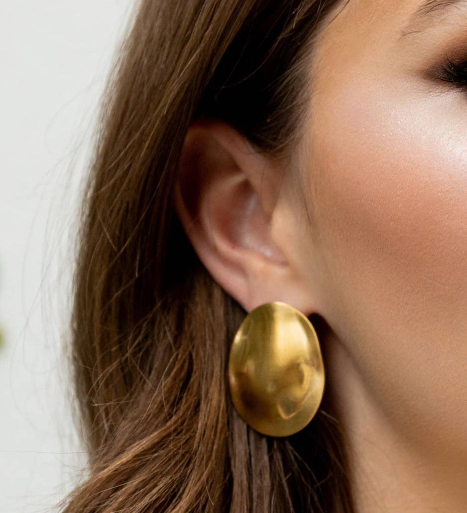 Statement earrings crafted from a sterling silver base with premium 18K gold plating, featuring a bold silhouette designed to turn heads. Hypoallergenic, water- and tarnish-resistant—perfect for adding effortless elegance from brunch to evening events.