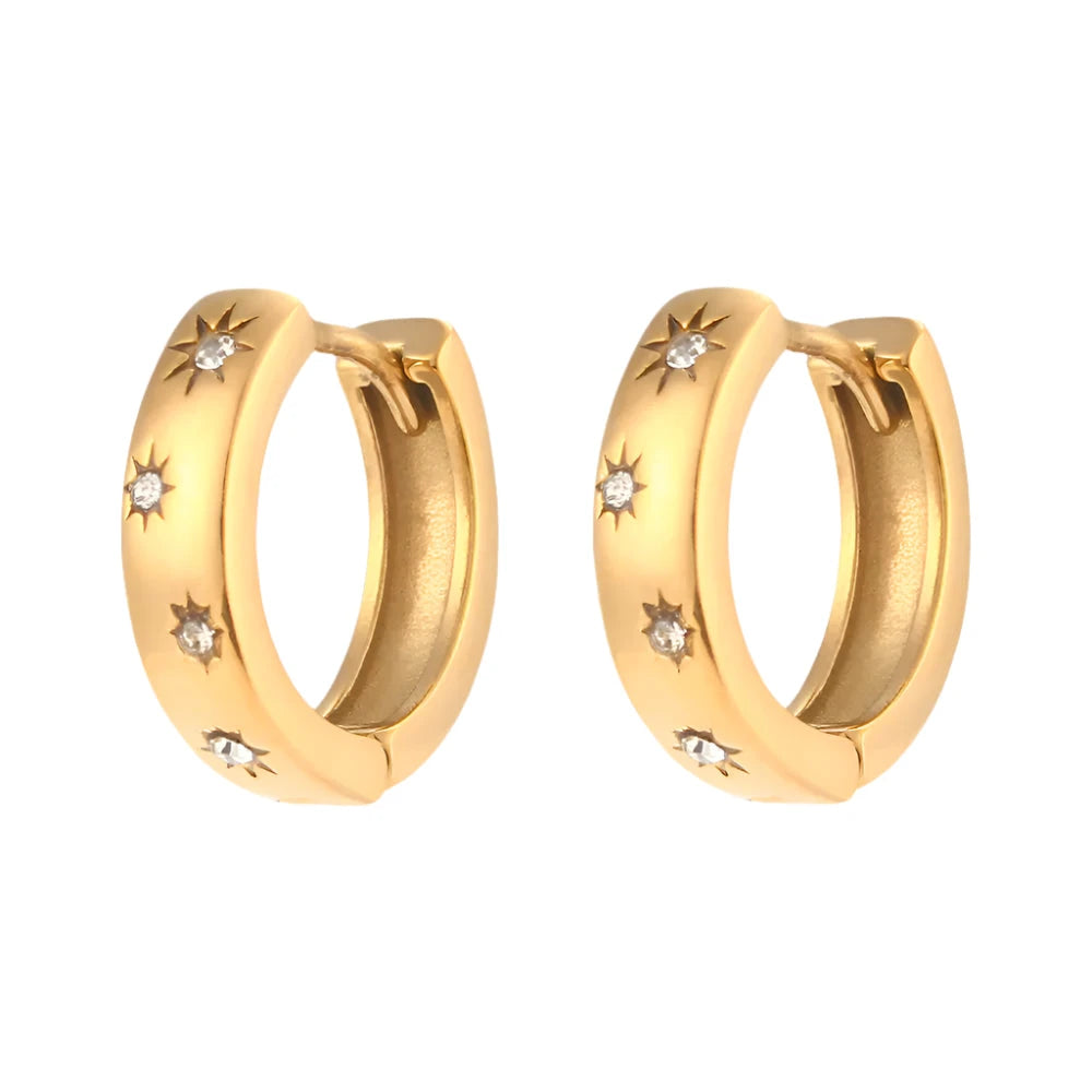Petite hoop earrings crafted from 18K gold-plated stainless steel, featuring delicate sunburst charms adorned with sparkling zircon detail symbolising light and energy. Hypoallergenic, water- and tarnish-resistant—perfect for adding modern elegance and radiant style to any look.