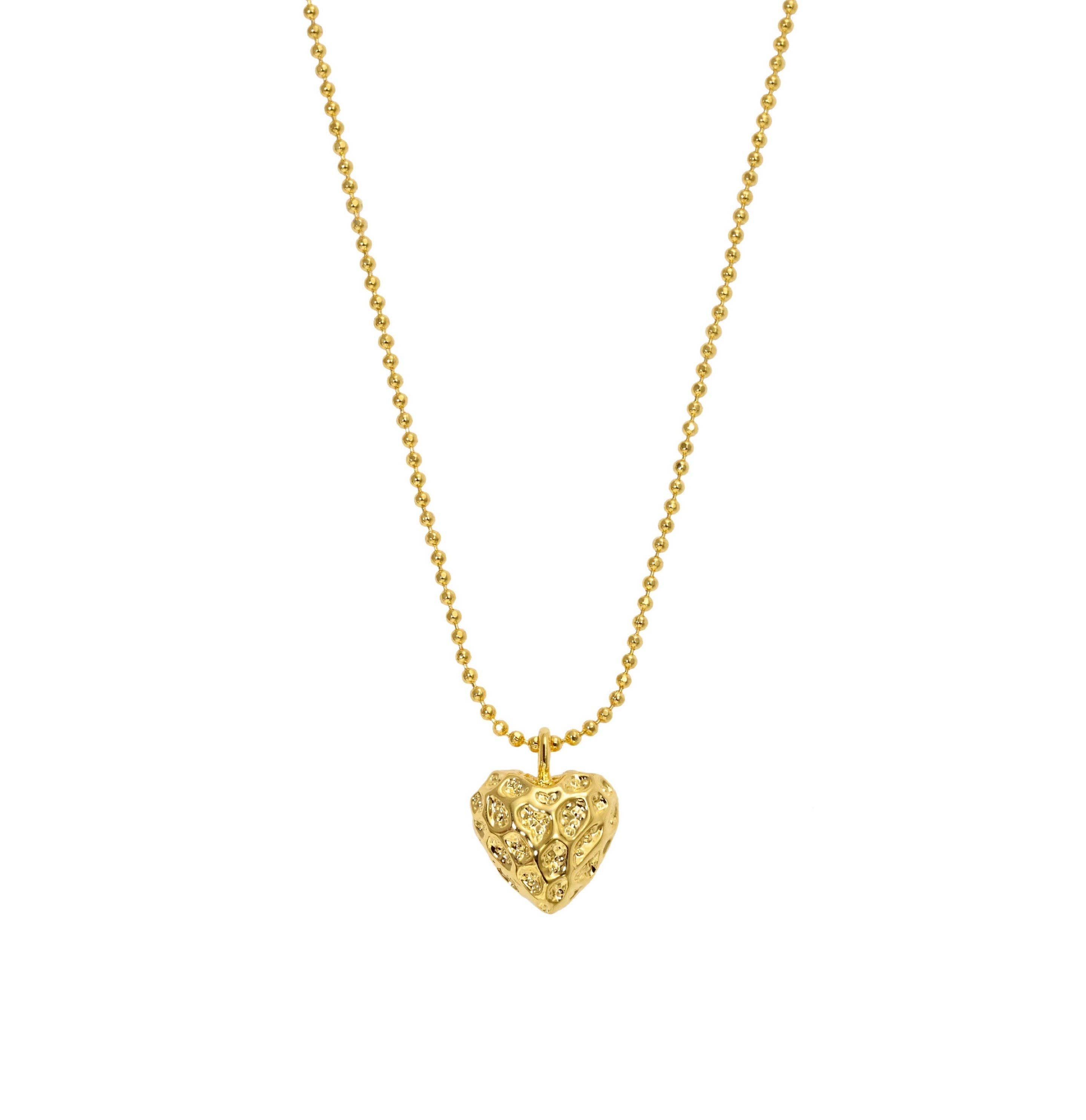 Delicate gold necklace featuring a softly hammered puffy heart pendant for a playful, textured shine. Crafted from 18K gold-plated stainless steel and available in multiple sizes. Hypoallergenic, water- and tarnish-resistant—an effortlessly refined piece perfect for everyday charm or layered styling.
