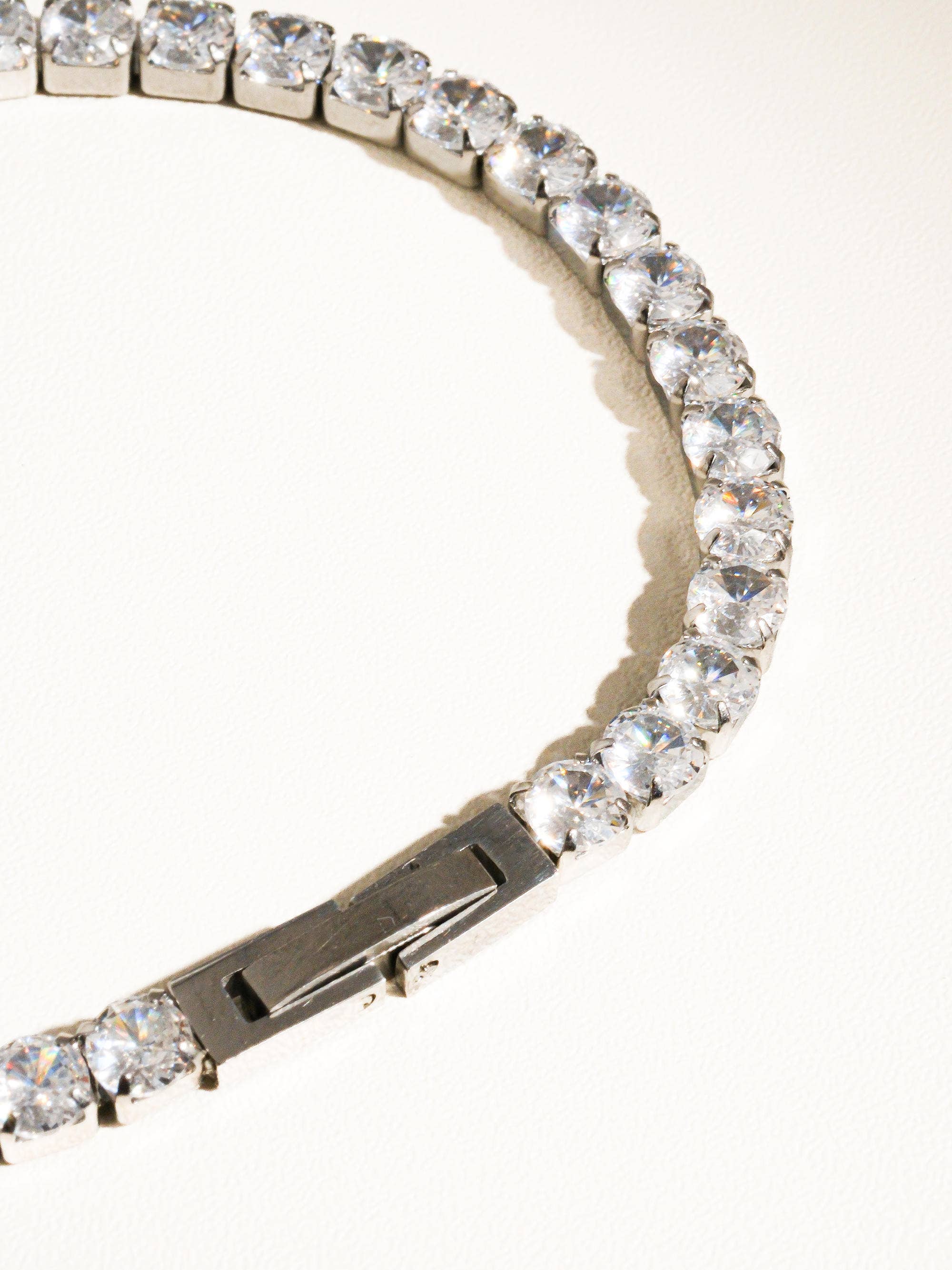 Elegant non-tarnish rhinestone bracelet made from stainless steel, featuring sparkling cubic zirconia stones along a 6-inch chain. Designed to be water-resistant, hypoallergenic, and free from lead and nickel, with a sleek and dressy style perfect for special occasions.