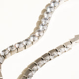 Elegant non-tarnish rhinestone bracelet made from stainless steel, featuring sparkling cubic zirconia stones along a 6-inch chain. Designed to be water-resistant, hypoallergenic, and free from lead and nickel, with a sleek and dressy style perfect for special occasions.
