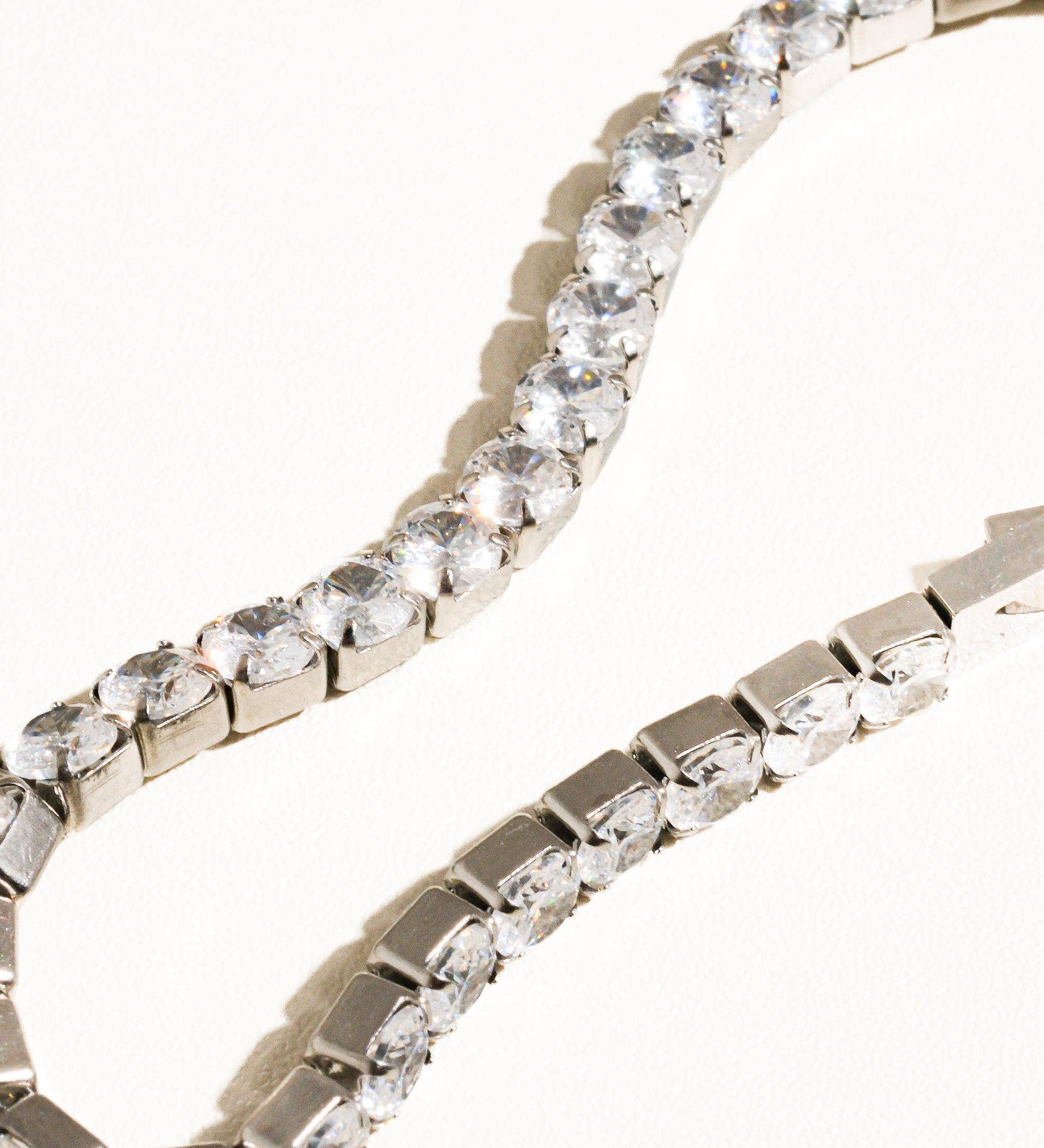 Elegant non-tarnish rhinestone bracelet made from stainless steel, featuring sparkling cubic zirconia stones along a 6-inch chain. Designed to be water-resistant, hypoallergenic, and free from lead and nickel, with a sleek and dressy style perfect for special occasions.
