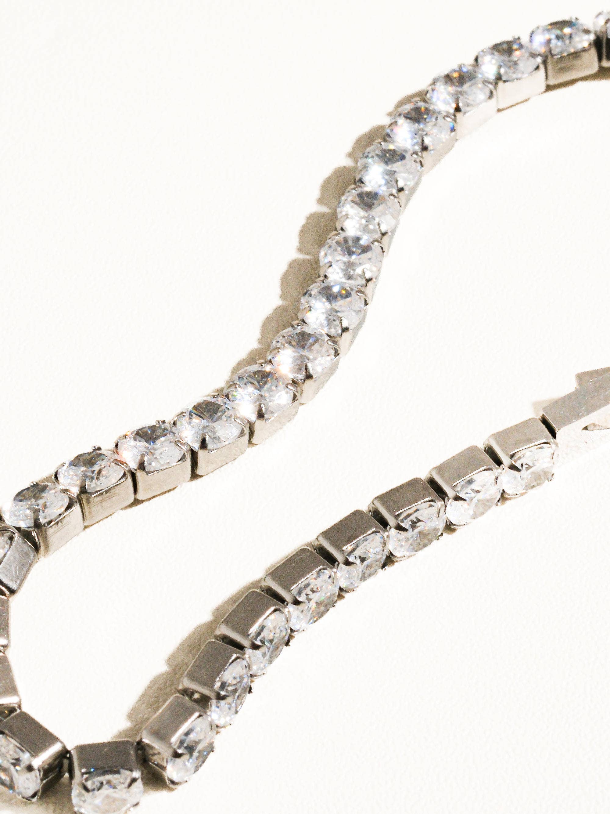 Elegant non-tarnish rhinestone bracelet made from stainless steel, featuring sparkling cubic zirconia stones along a 6-inch chain. Designed to be water-resistant, hypoallergenic, and free from lead and nickel, with a sleek and dressy style perfect for special occasions.