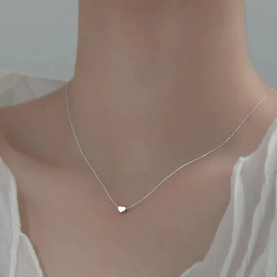 Delicate necklace crafted from premium materials, featuring a petite heart pendant accented with a sparkling zircon centre. Minimalist and elegant—perfect for expressing love and adding subtle shine to any look. Hypoallergenic, water- and tarnish-resistant.