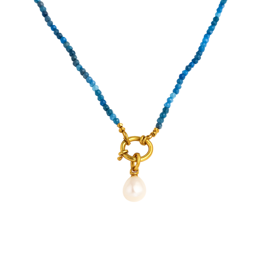 Delicate necklace featuring tiny natural apatite stones paired with a lustrous freshwater pearl charm. Crafted from water-resistant, tarnish-resistant stainless steel with gold plating. Hypoallergenic—perfect for adding natural elegance and effortless sophistication to any jewellery collection.