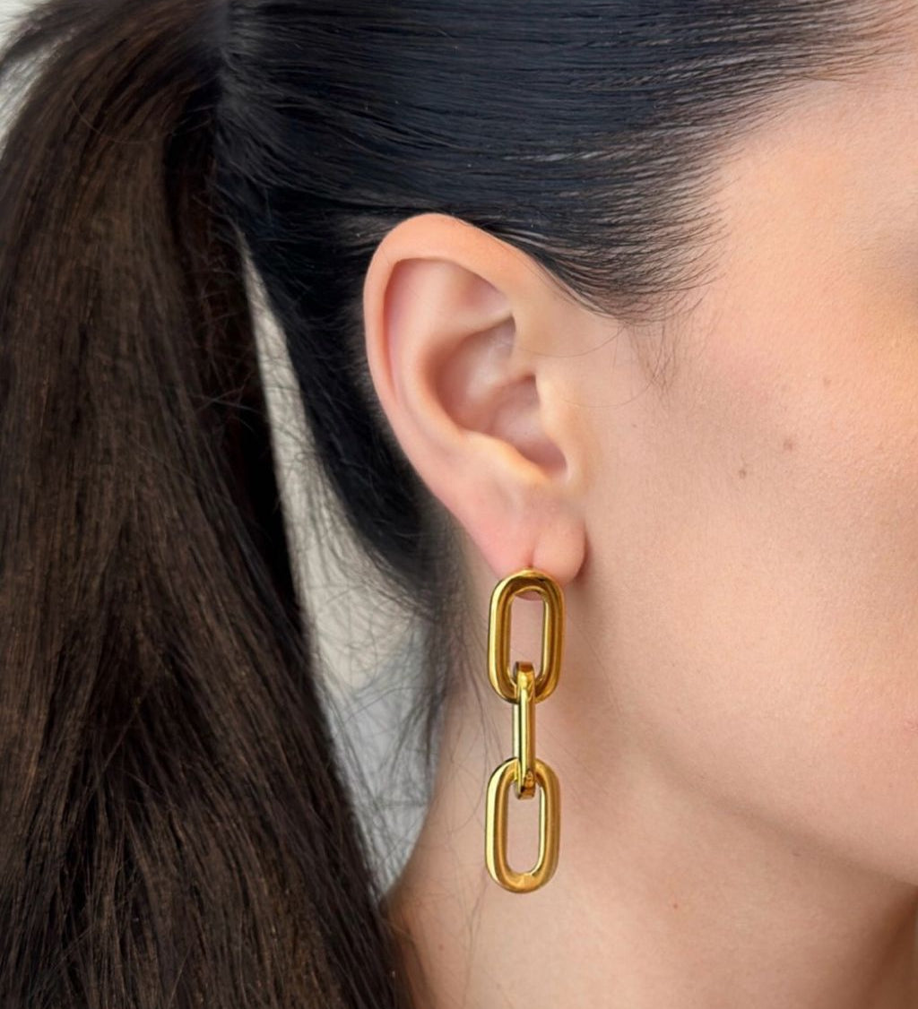Sleek link earrings crafted from gold-plated material, featuring a modern, minimalist design that balances bold style with refined elegance. Hypoallergenic, water- and tarnish-resistant—perfect for elevating any outfit, from casual looks to special occasions.