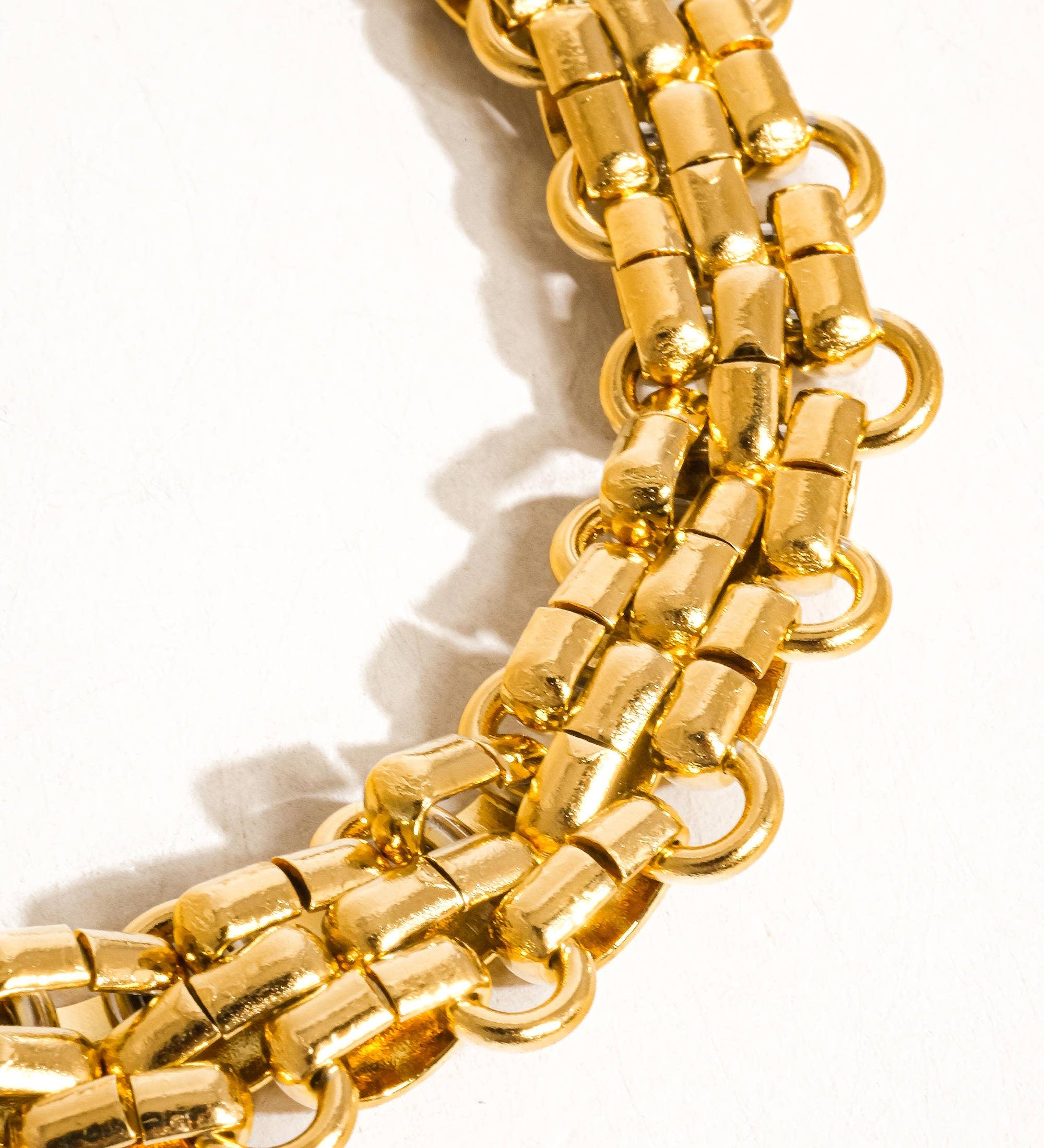 Striking bracelet crafted from stainless steel with 18K gold plating, featuring a bold weave pattern for a contemporary, textured look. Chain length 7.09 inches. Hypoallergenic, water- and tarnish-resistant—perfect for adding luxe sophistication and strength to any ensemble.