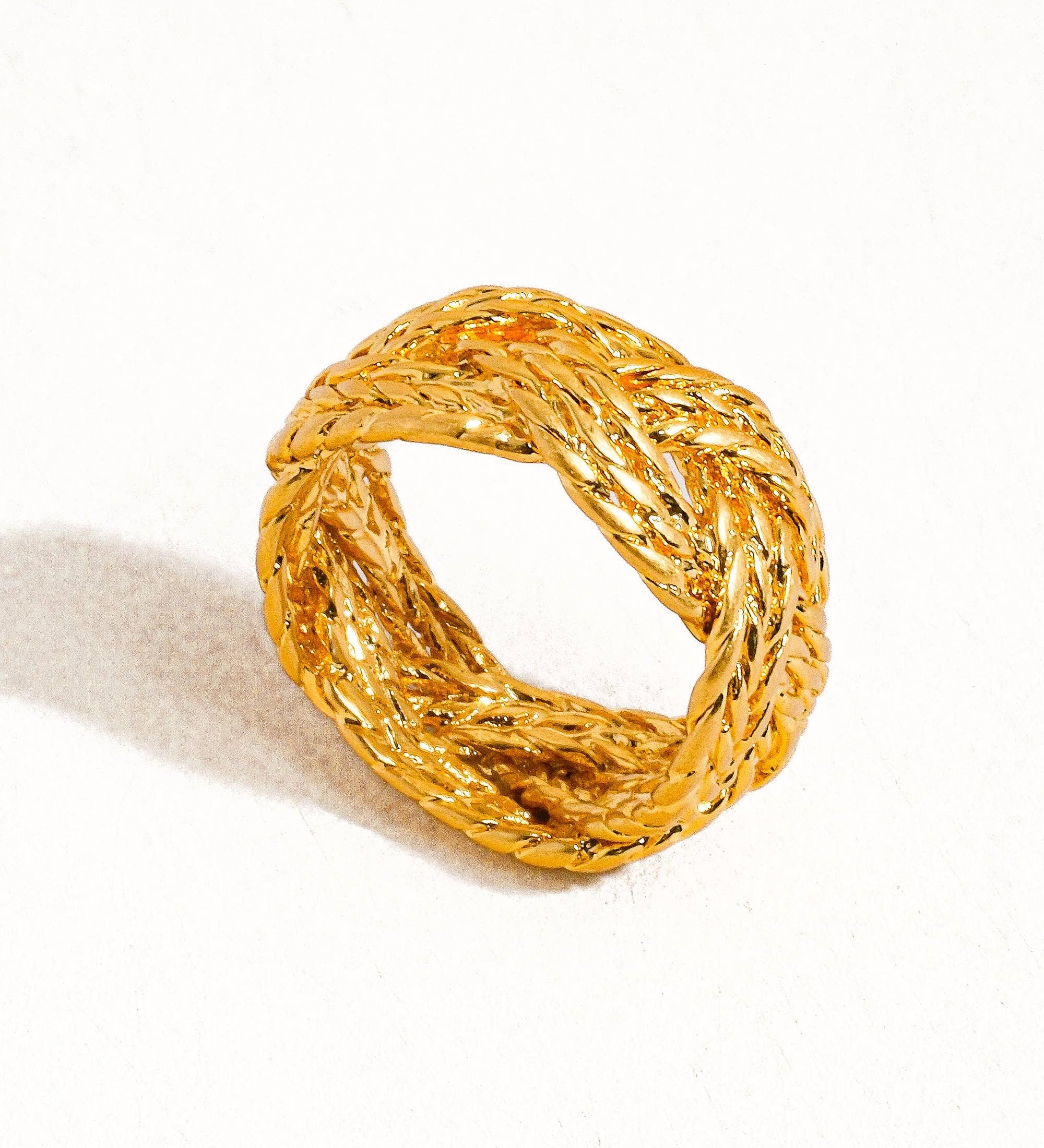 Sculptural vintage-inspired ring with a polished gold twist design, crafted from 18K gold-plated brass. Sized at US 7 (0.682" diameter), this hypoallergenic, water- and tarnish-resistant piece blends timeless charm with everyday wearability.