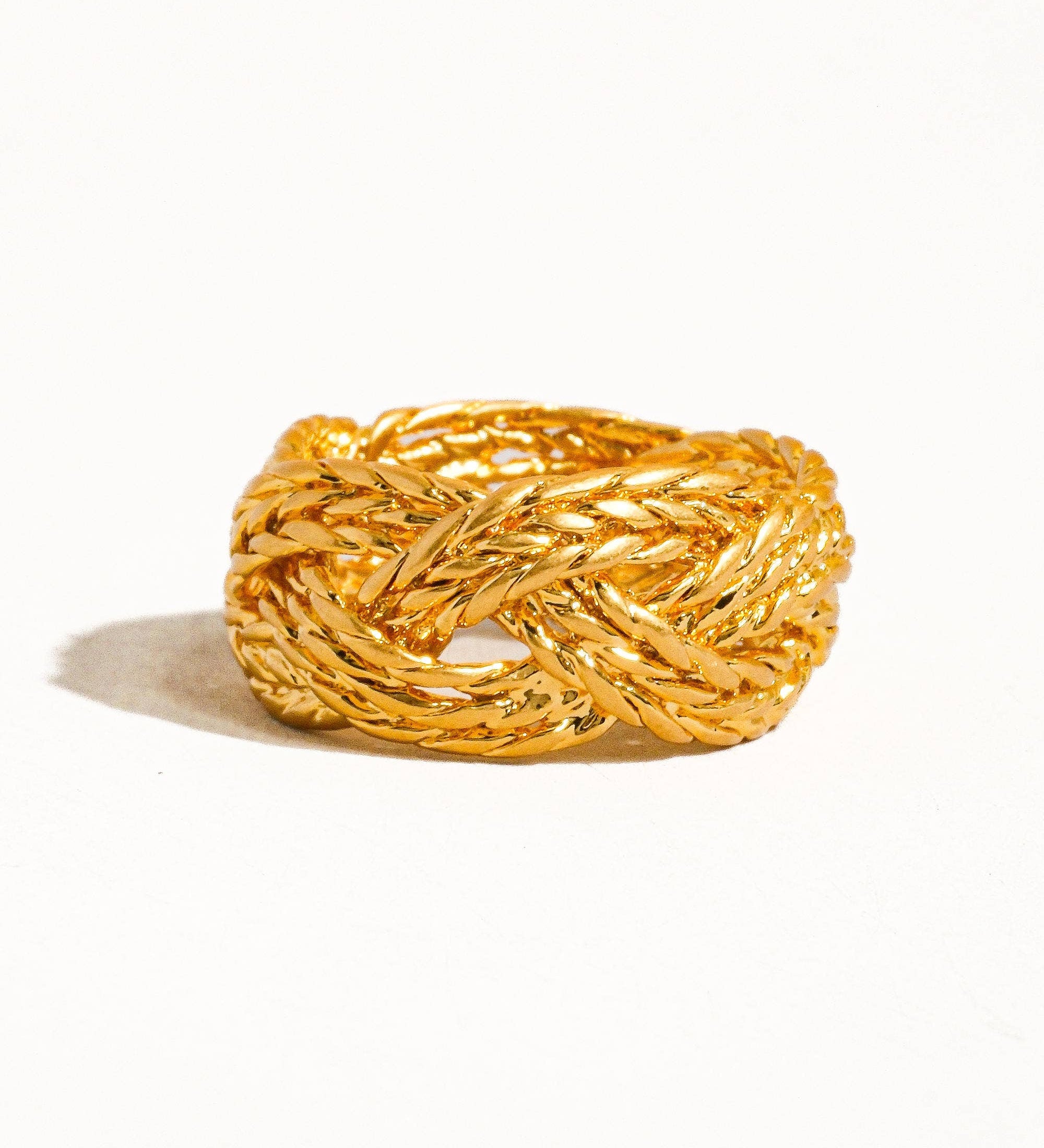 Sculptural vintage-inspired ring with a polished gold twist design, crafted from 18K gold-plated brass. Sized at US 7 (0.682" diameter), this hypoallergenic, water- and tarnish-resistant piece blends timeless charm with everyday wearability.