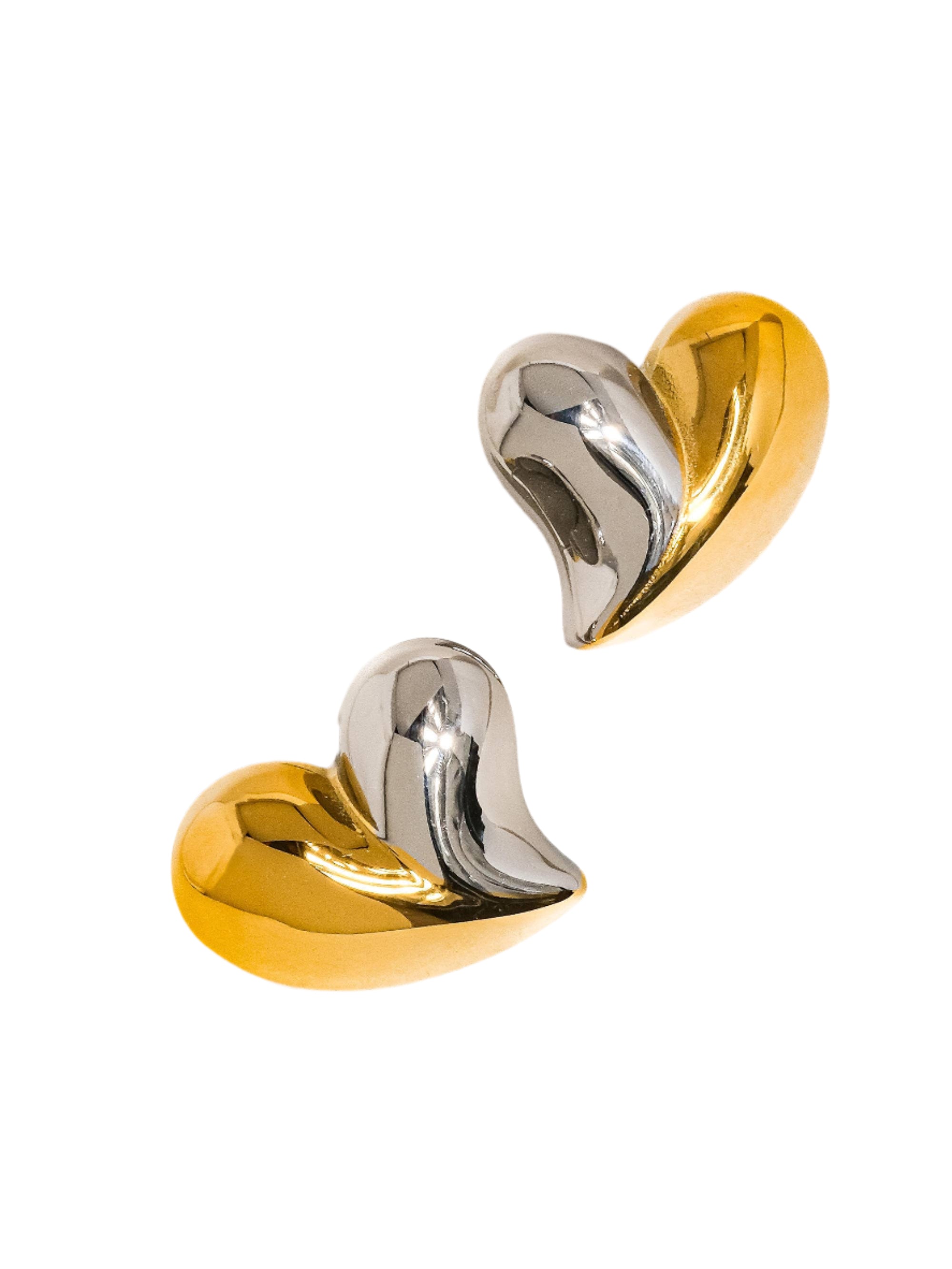 Sculptural heart-shaped stud earrings in a polished two-tone gold and silver finish. Crafted from 18K gold-plated stainless steel, measuring 1 x 0.9 inches. Hypoallergenic, water- and tarnish-resistant—bold romantic accents, perfect for everyday wear or special moments.