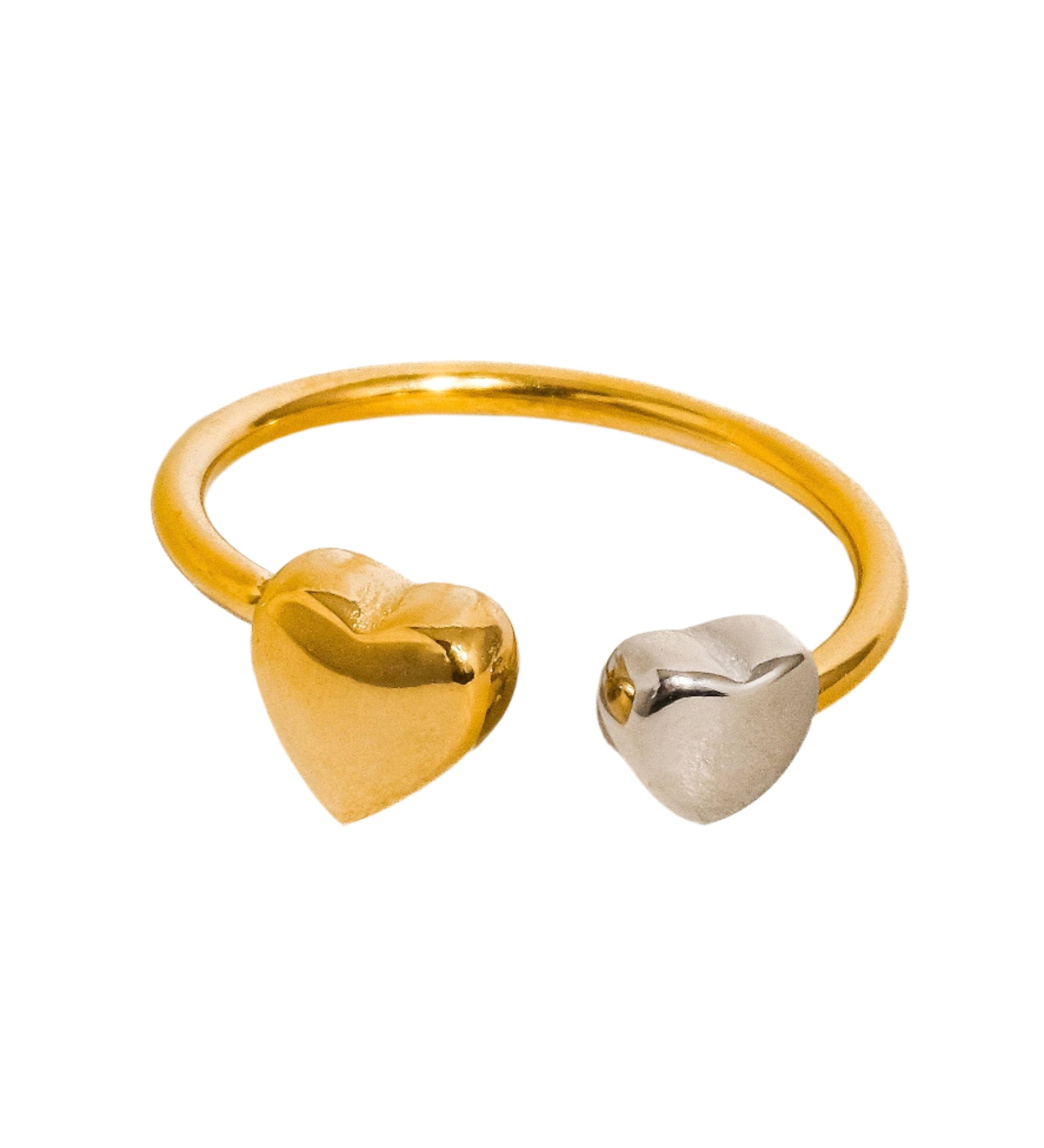 Striking sculptural ring with a two-tone heart design in polished gold and silver, crafted for a bold romantic statement. Made from 18K gold-plated stainless steel in US size 7 (0.682" diameter). Hypoallergenic, water- and tarnish-resistant—perfect for standout style or heartfelt gifting.