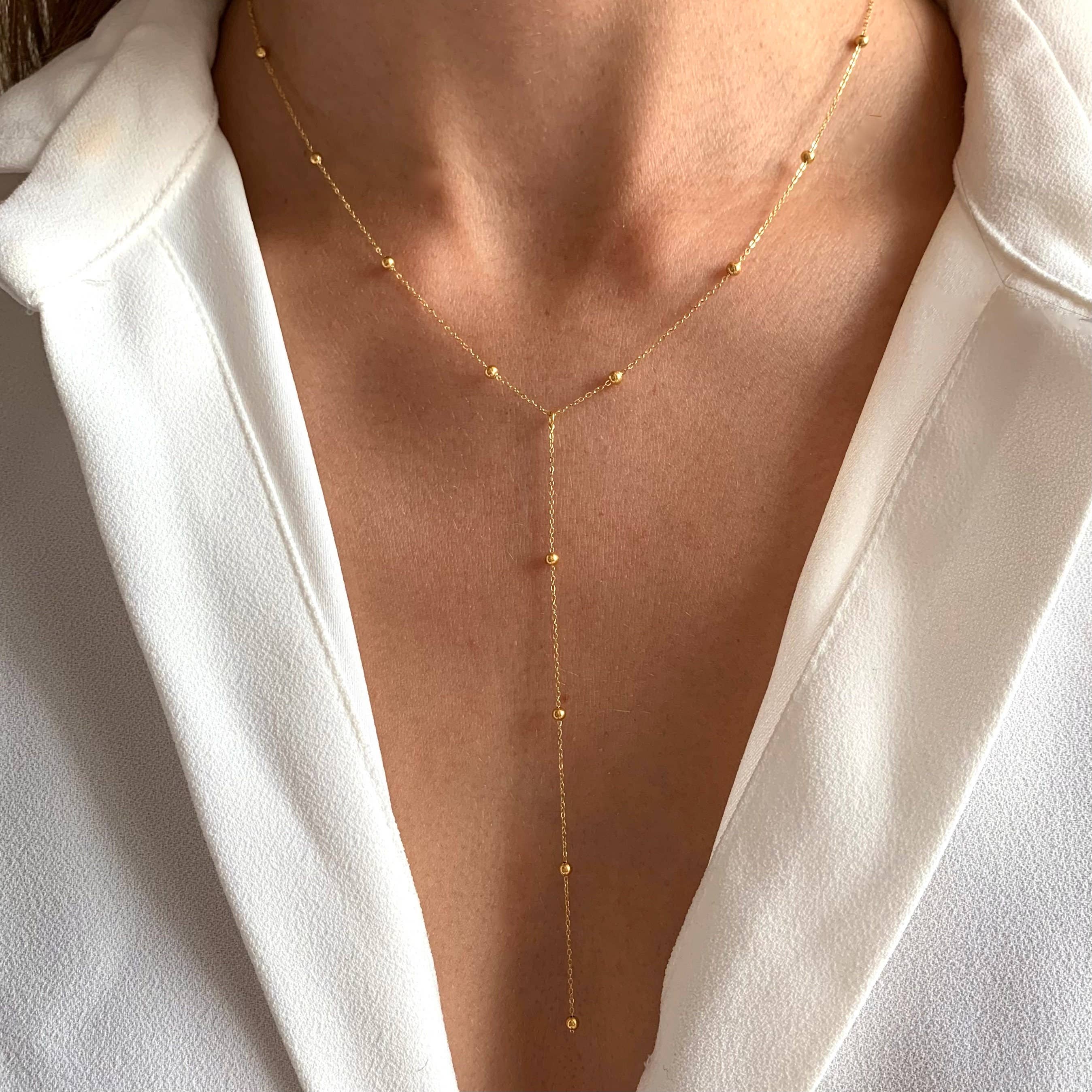 Minimalist Y-shaped necklace crafted from high-quality stainless steel with a sleek ball chain design. Creates a delicate drop effect that’s flattering and timeless. Hypoallergenic, water- and tarnish-resistant—perfect for elevating everyday looks with subtle sophistication.