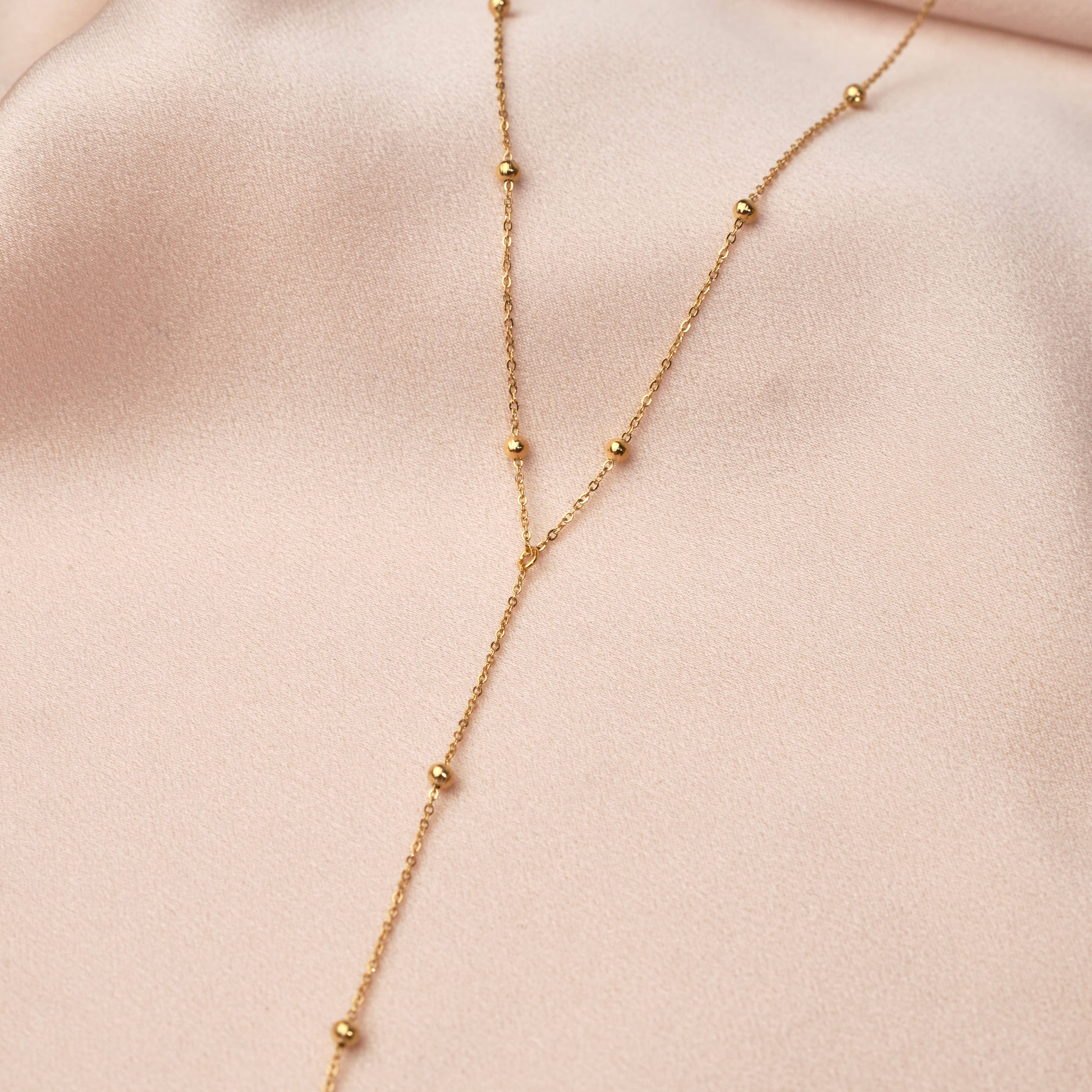 Minimalist Y-shaped necklace crafted from high-quality stainless steel with a sleek ball chain design. Creates a delicate drop effect that’s flattering and timeless. Hypoallergenic, water- and tarnish-resistant—perfect for elevating everyday looks with subtle sophistication.